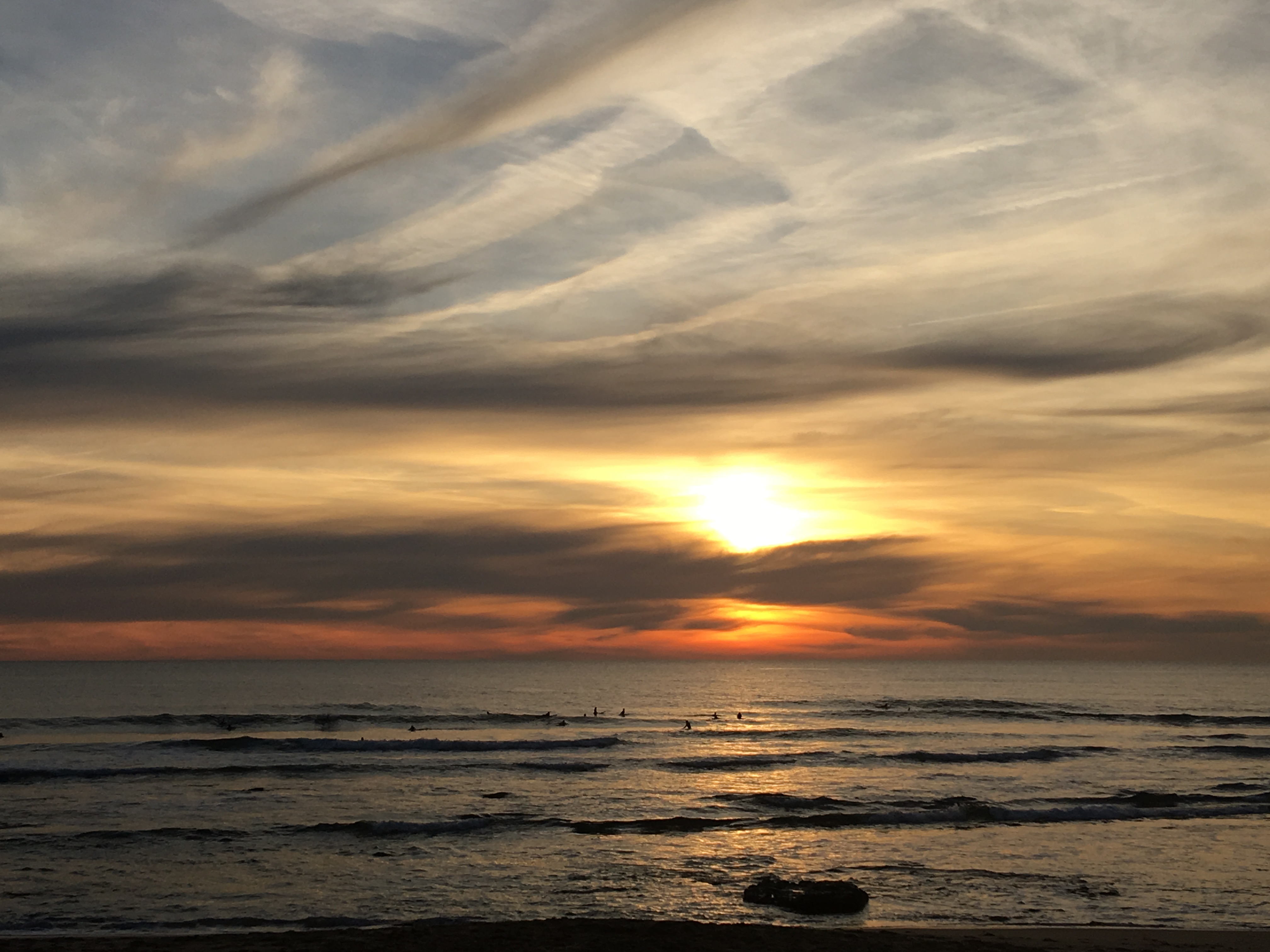 Sunset in Portugal with surfers